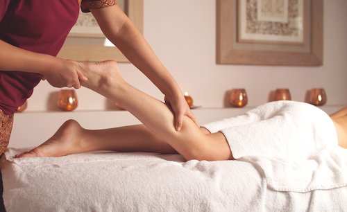 female therapist gives a relaxing foot massage. Relax in the Spa after a busy day.